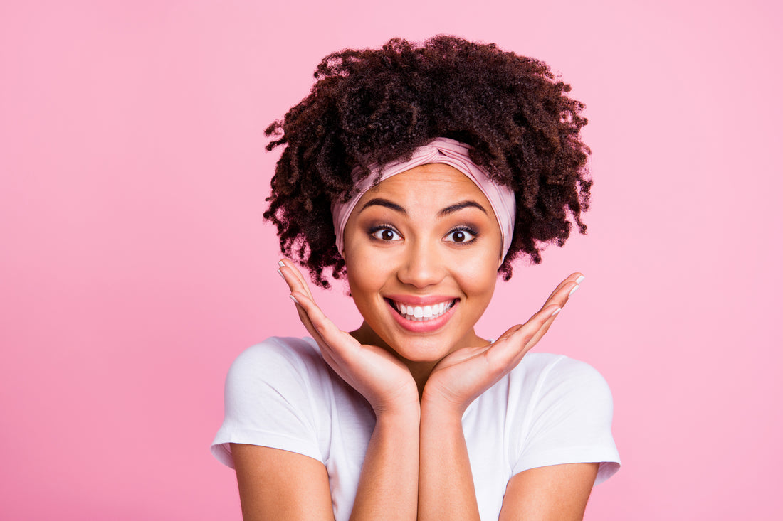 Woman with glowing skin after using sea moss gel